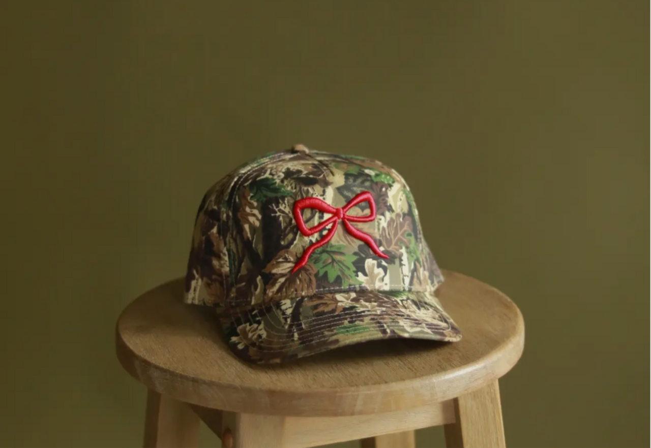 Camo red bow trucker