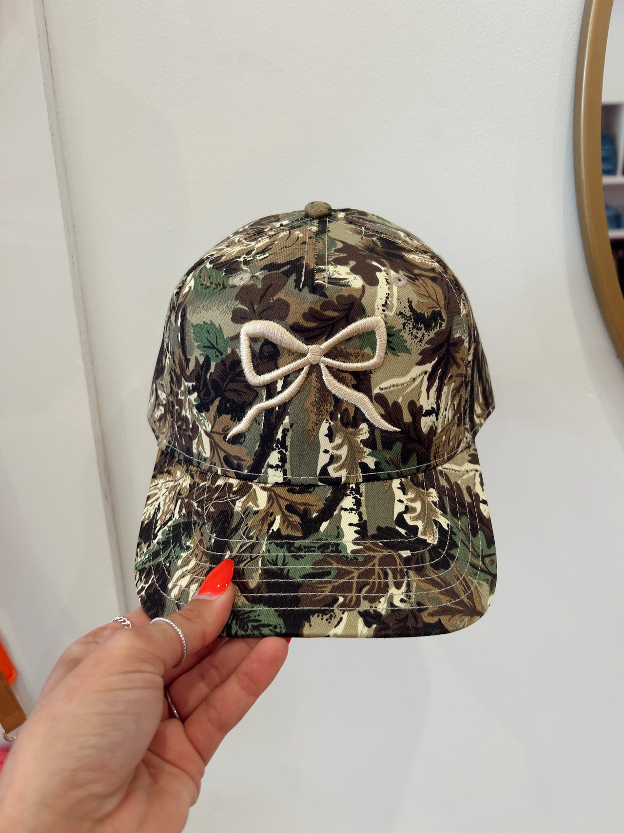 Camo cream bow trucker