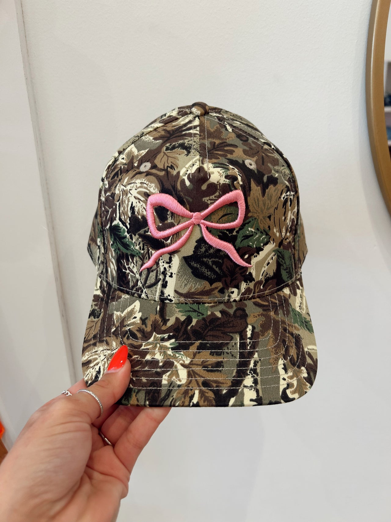 Camo pink bow trucker