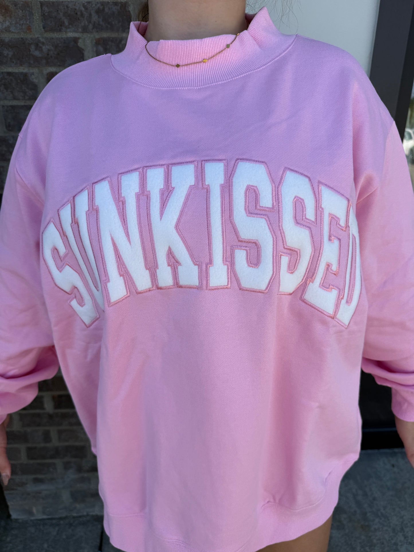 Lottie Pink Varsity Sunkissed
Embroidered Mockneck Sweatshirt