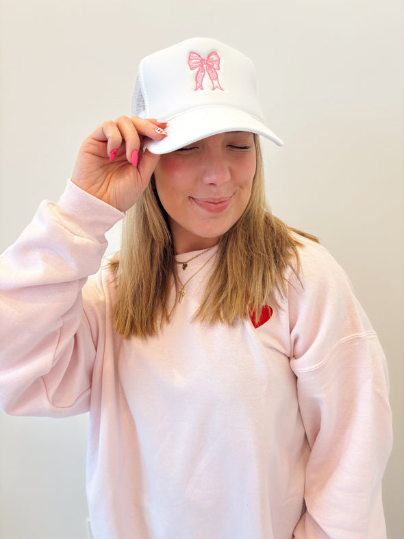 white bow trucker hat