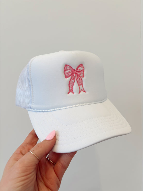 white bow trucker hat