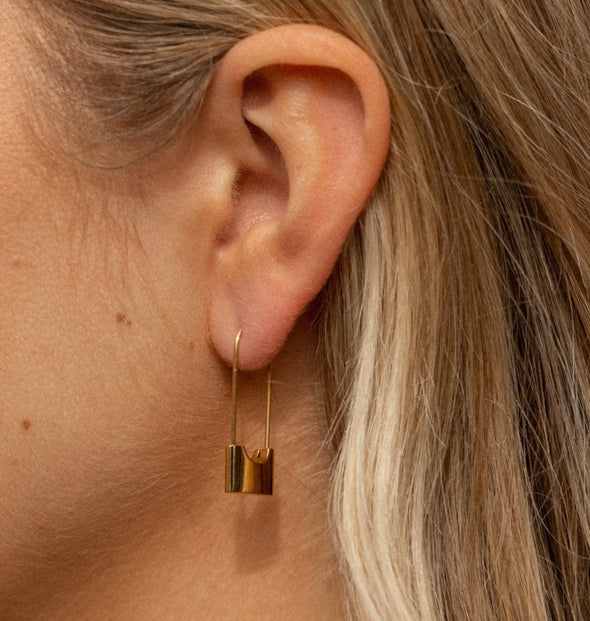 motivated earrings gold